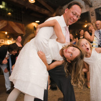 people dancing at a wedding while hot jazz music plays